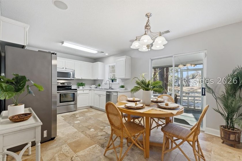 Freshly updated, this 4BR/2BA home located in The Farm offers a - photo 13