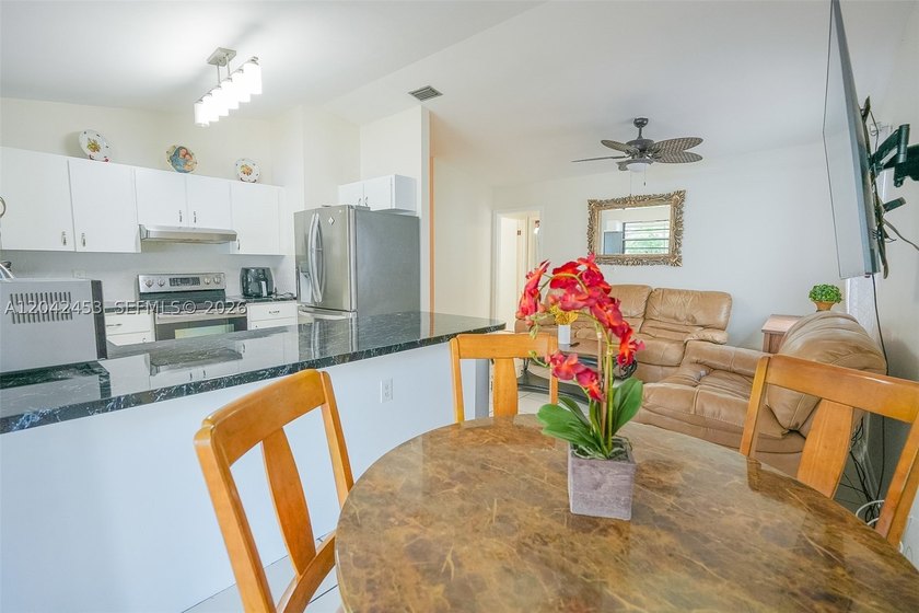 This charming 1988-built residence offers three bedrooms and two - photo 7