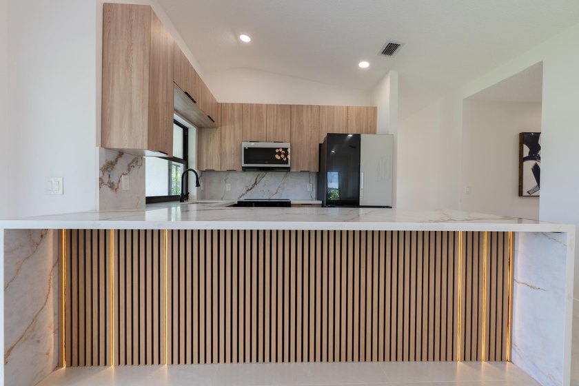 Welcome home to this extensively renovated lakefront home in the - photo 5