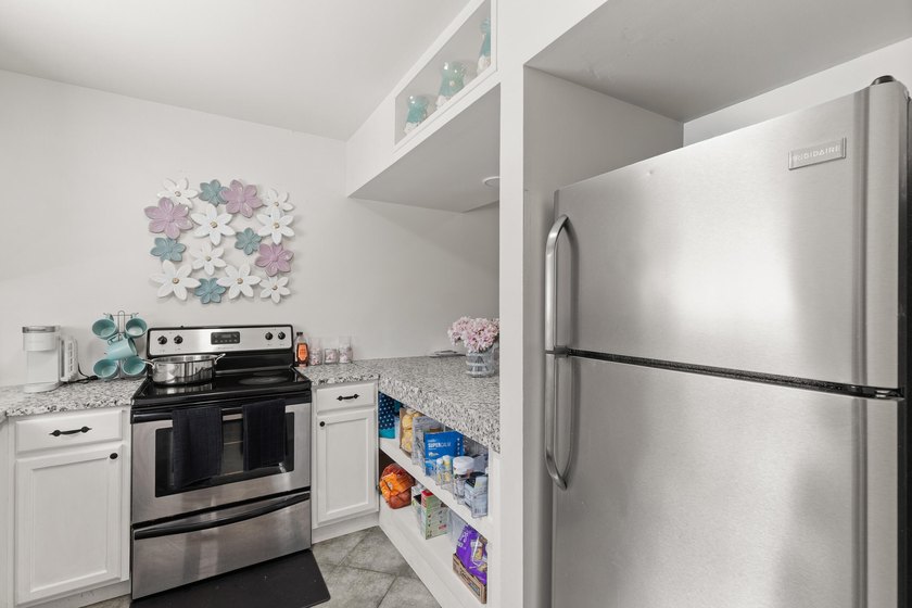 This renovated 2-bedroom, 2-bath condo has a newer roof (2022) - photo 5