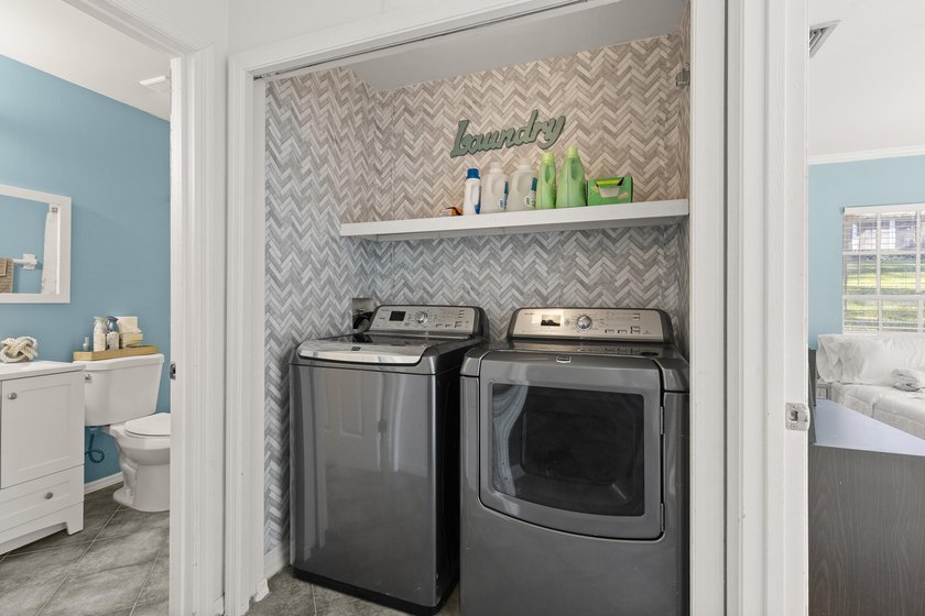 This renovated 2-bedroom, 2-bath condo has a newer roof (2022) - photo 9