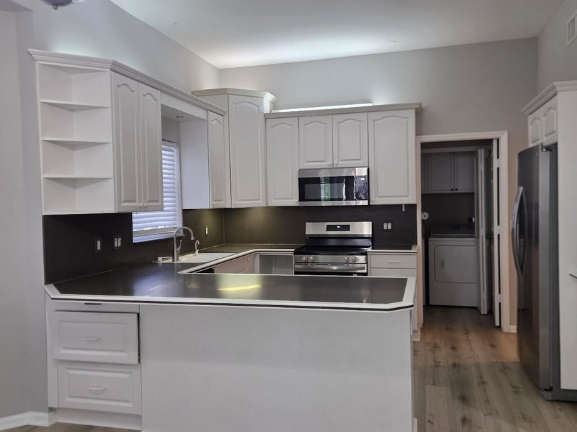 Beautiful 4-bedroom, 2.5-bath two-story lakefront home with a - photo 5