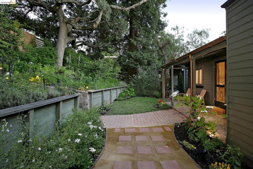 Tucked discreetly behind a gate in the heart of Montclair, this - photo 2