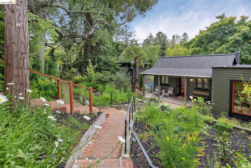 Tucked discreetly behind a gate in the heart of Montclair, this - photo 4