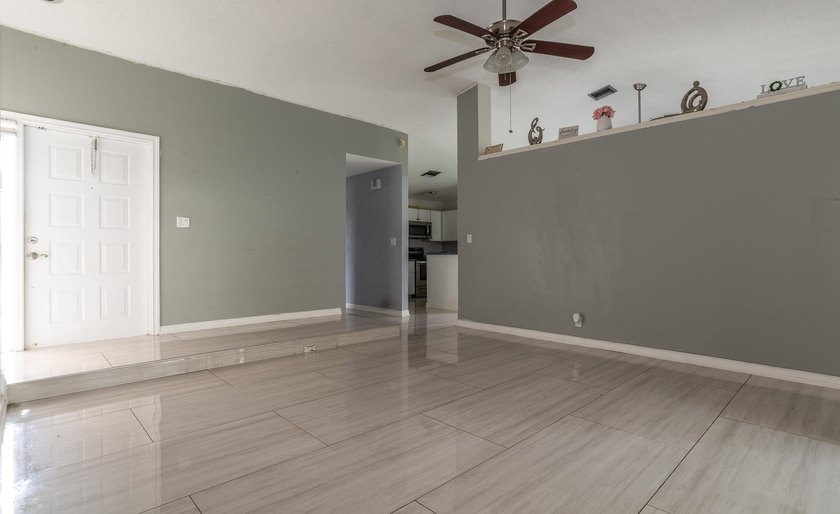 This 3-bedroom, 2-bathroom single-story home offers 1,672 square - photo 8