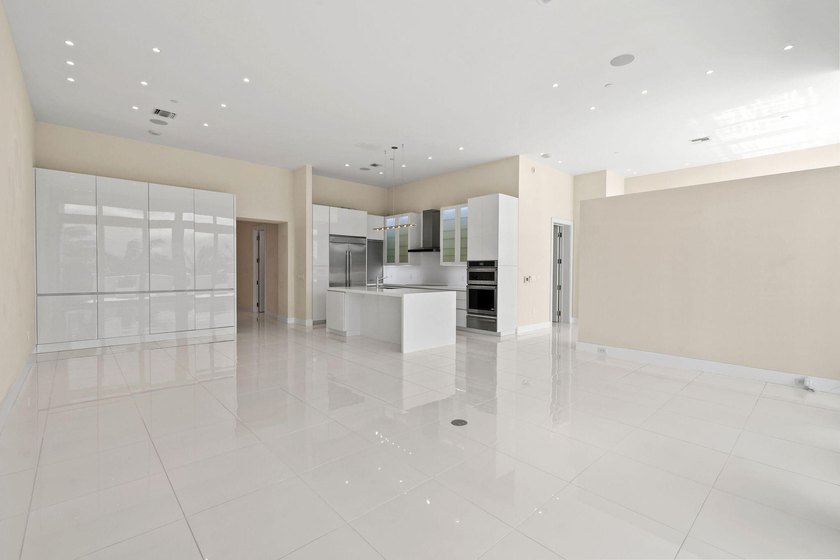 Step through the lobby level entry into ceilings that hold at - photo 6
