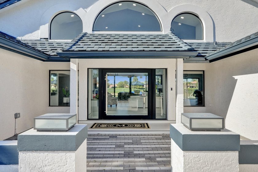 Experience refined South Florida living in this fully renovated - photo 4