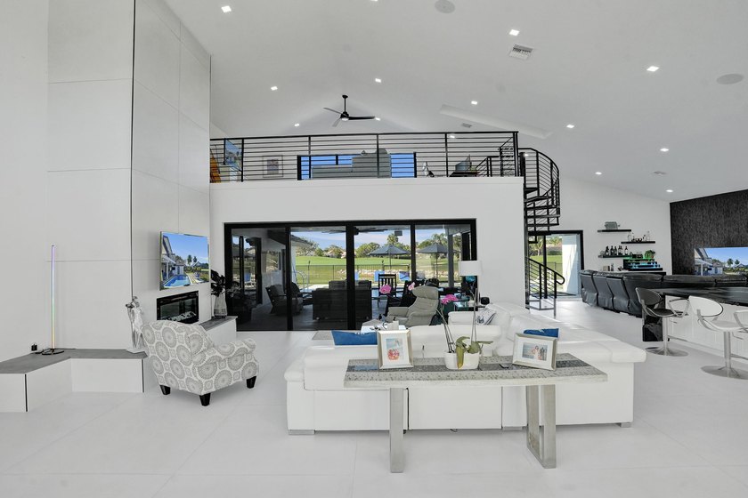 Experience refined South Florida living in this fully renovated - photo 6