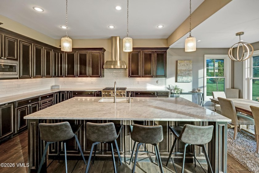 Welcome home to the coveted Eagle Ranch community, where - photo 12