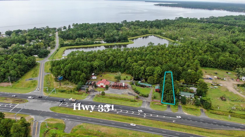 This vacant land is just over the 331 Bridge a mile in to - photo 3