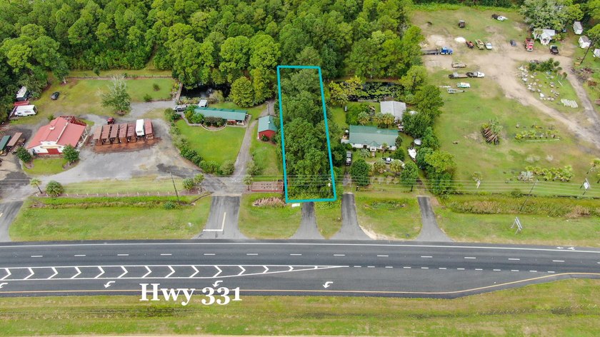 This vacant land is just over the 331 Bridge a mile in to - photo 4