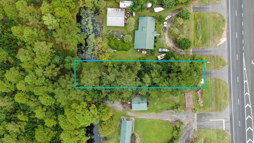 This vacant land is just over the 331 Bridge a mile in to - photo 5