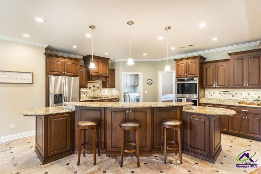 Welcome home to this stunning custom-built, four-sided brick - photo 13