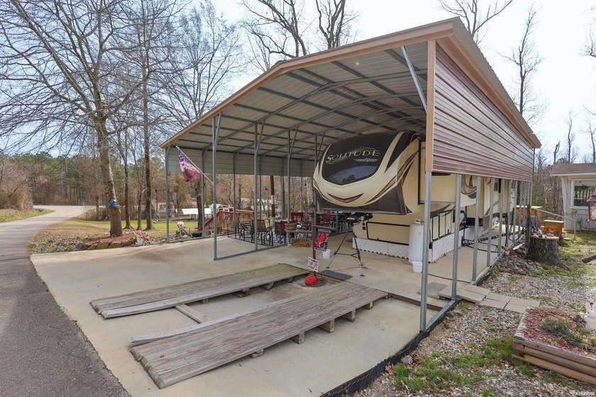 Conveniently located near Lake Greeson and area ATV trails, this - photo 15
