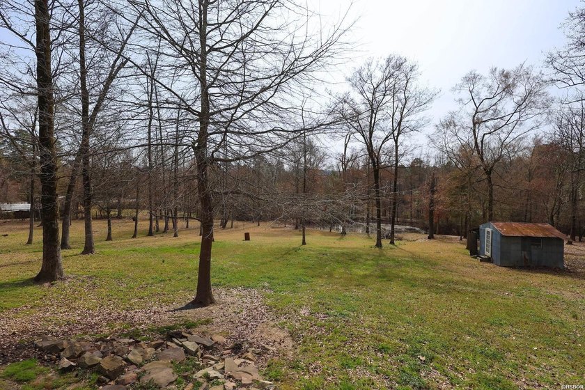 Conveniently located near Lake Greeson and area ATV trails, this - photo 16