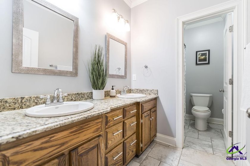Welcome home to this stunning custom-built, four-sided brick - photo 29
