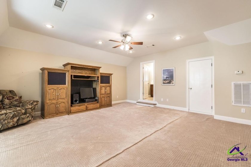 Welcome home to this stunning custom-built, four-sided brick - photo 34