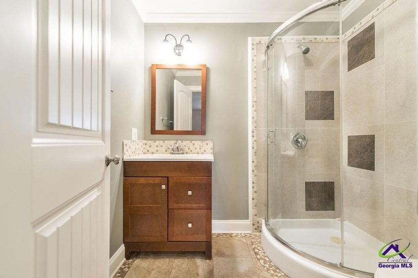 Welcome home to this stunning custom-built, four-sided brick - photo 36
