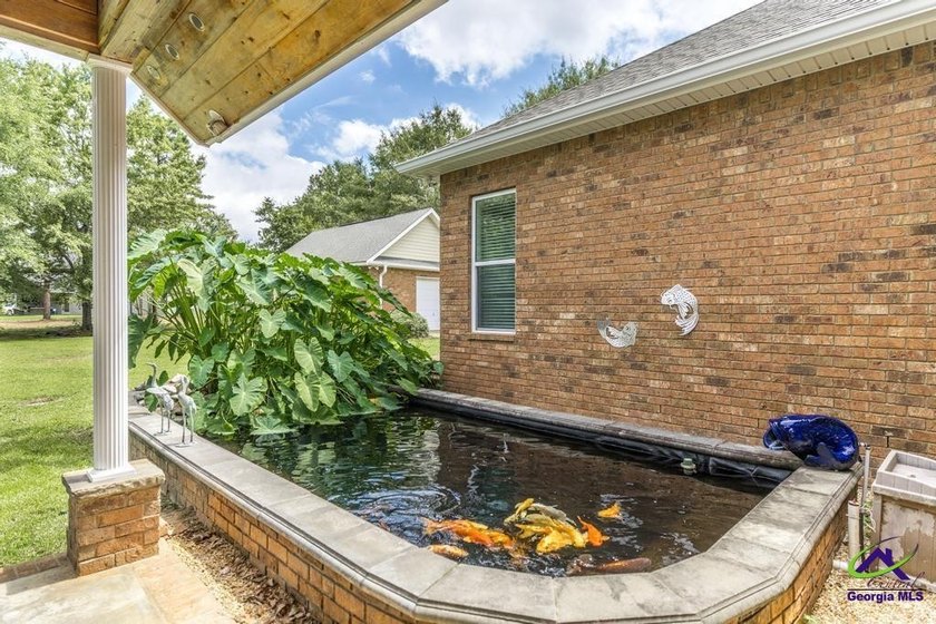 Welcome home to this stunning custom-built, four-sided brick - photo 42