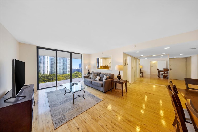 Brand-new floor-to-ceiling impact windows enhance this bright - photo 2