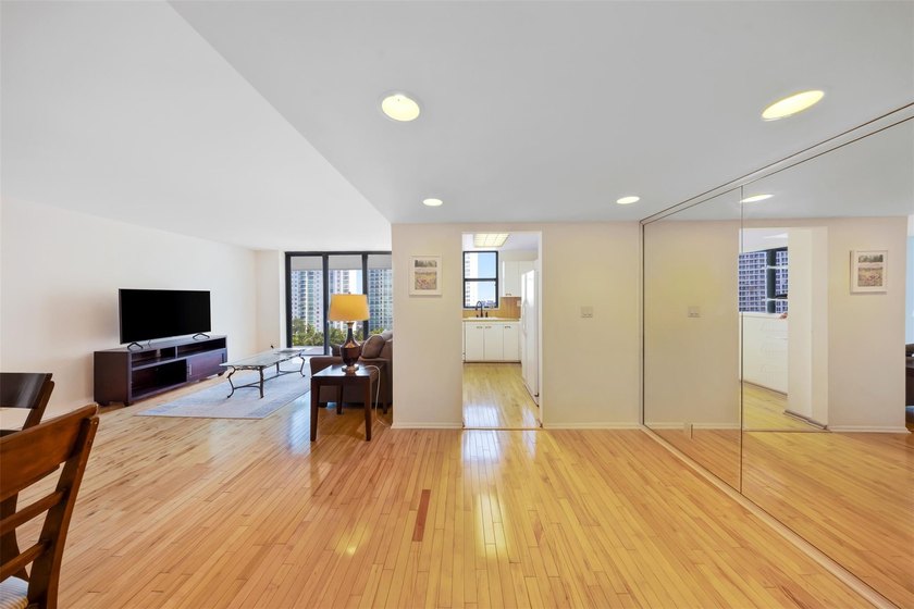 Brand-new floor-to-ceiling impact windows enhance this bright - photo 4