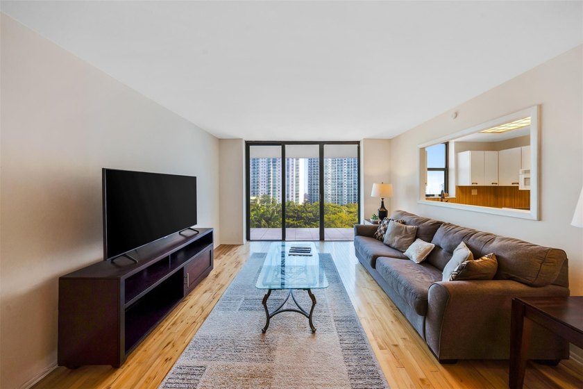 Brand-new floor-to-ceiling impact windows enhance this bright - photo 7