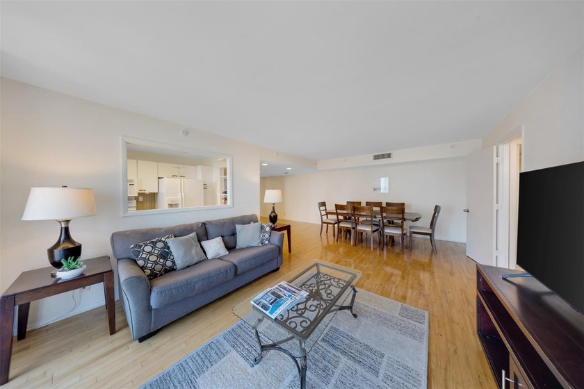 Brand-new floor-to-ceiling impact windows enhance this bright - photo 10