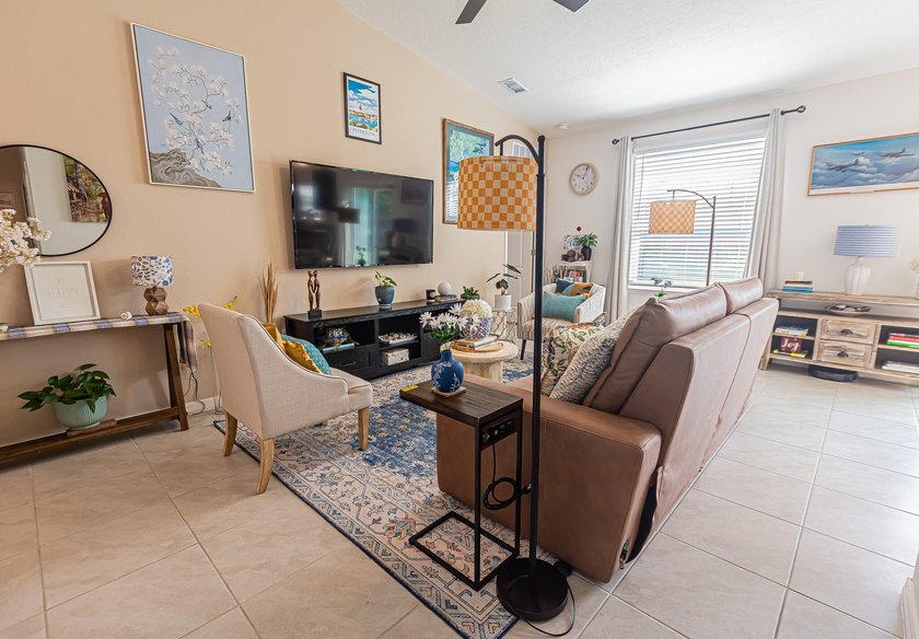 Built in 2023, this 3/2/2 CBS home perfectly combines modern - photo 2
