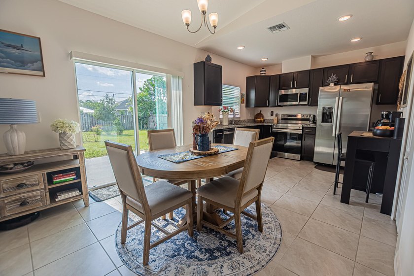 Built in 2023, this 3/2/2 CBS home perfectly combines modern - photo 5
