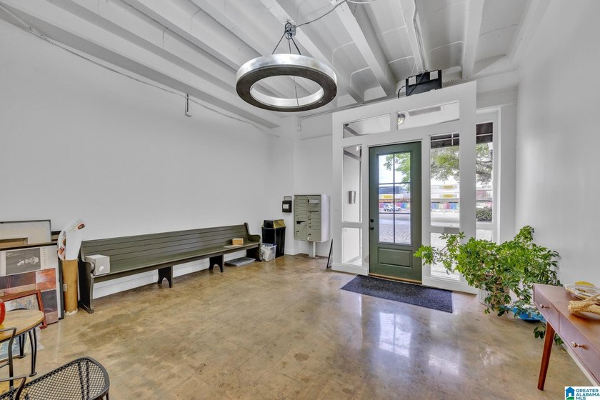 Step inside this inviting living space where exposed brick walls - photo 22