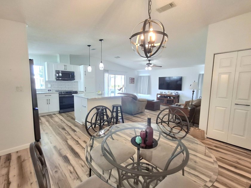 Fully furnished 2/2 home featuring a modern remodeled kitchen - photo 7