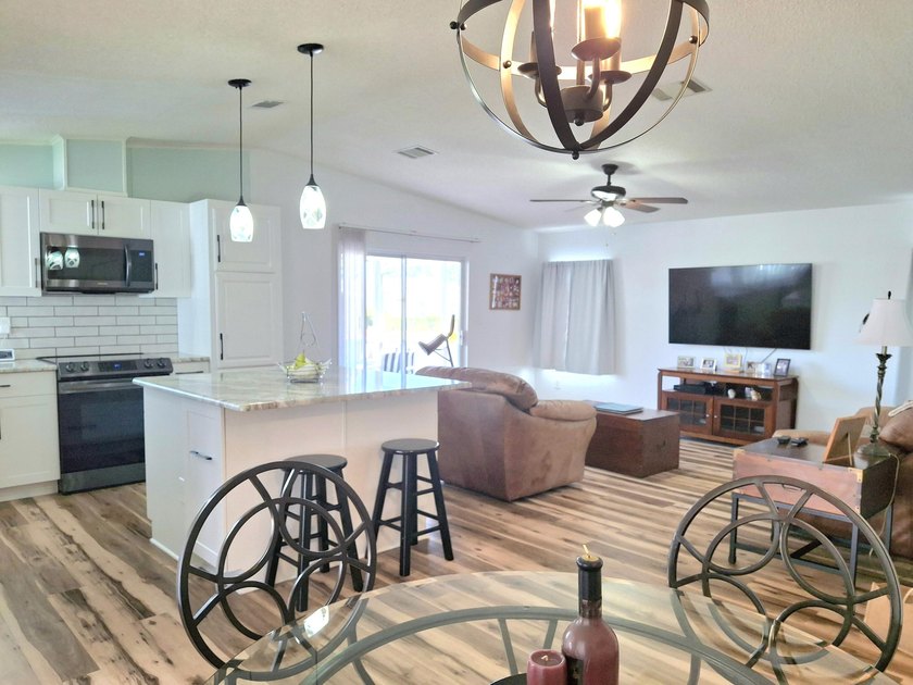 Fully furnished 2/2 home featuring a modern remodeled kitchen - photo 9
