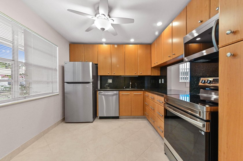 Step inside this beautiful 2-bedroom, 2-bathroom end-unit villa - photo 12