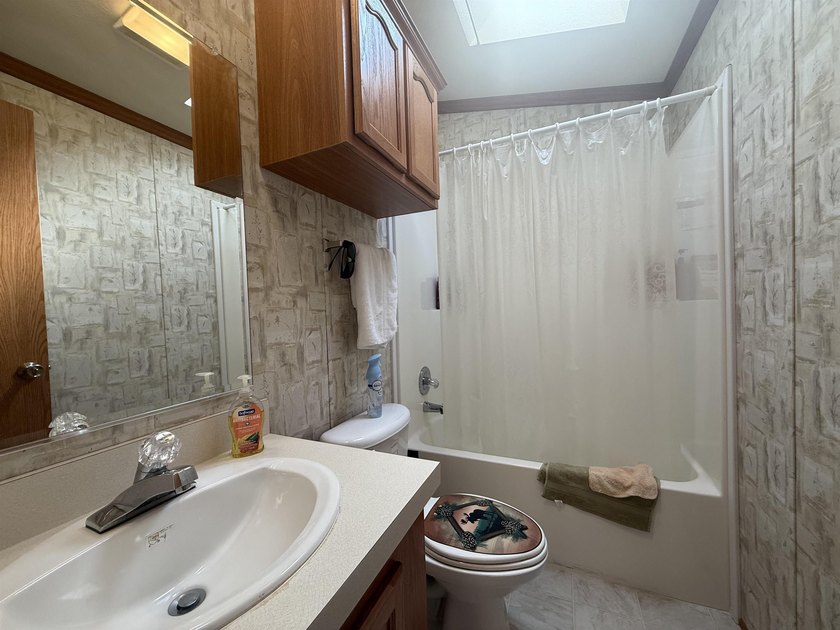 Welcome to this charming 3-bedroom, 2-bath home located in the - photo 16