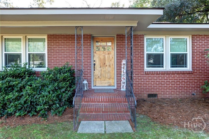 This immaculate, solid Mid-Century Brick Home sits on a large - photo 3
