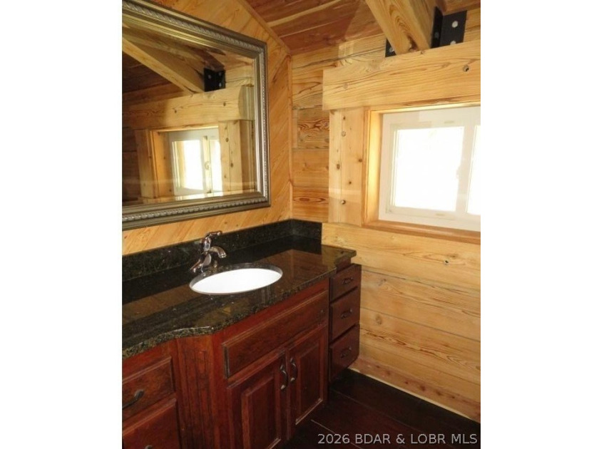 A VIEW FOR MILES! This one-of-a-kind custom log home showcases - photo 23