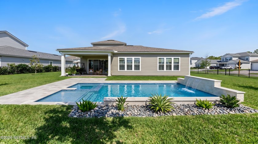 THIS HOME FEELS BRAND NEW! Located on a rare .38-acre fully - photo 2