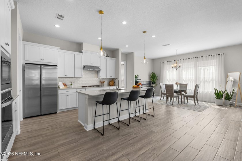 THIS HOME FEELS BRAND NEW! Located on a rare .38-acre fully - photo 4