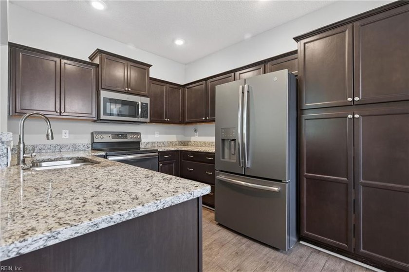 Enjoy easy one-level living in the sought-after Promenade at - photo 8