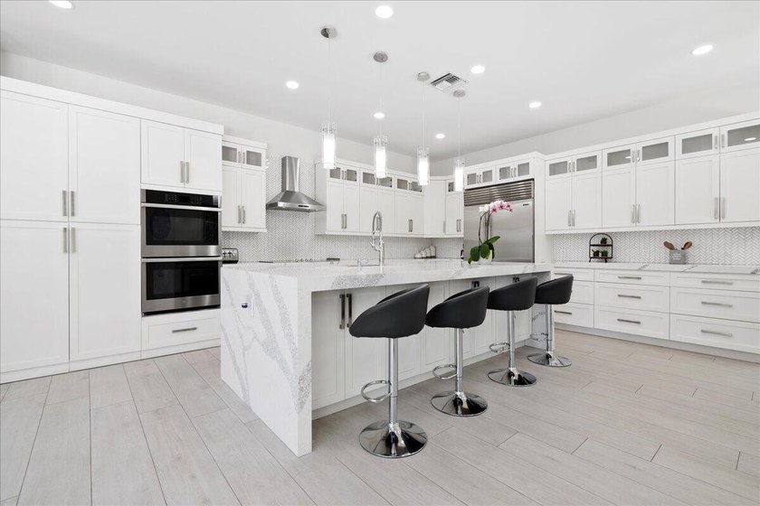 Come see this meticulously renovated residence is located in the - photo 12