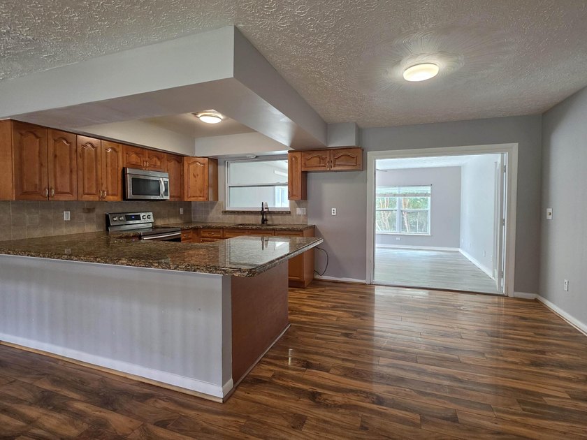 Discover this 3-bedroom, 2-bathroom home features an attached - photo 5