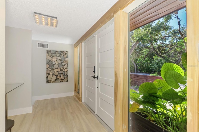 Now is your opportunity to own this waterfront tropical oasis on - photo 8