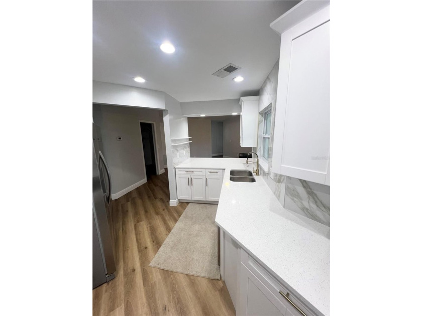 Fully remodeled, this stunning 3-bedroom, 2-bath single-family - photo 11