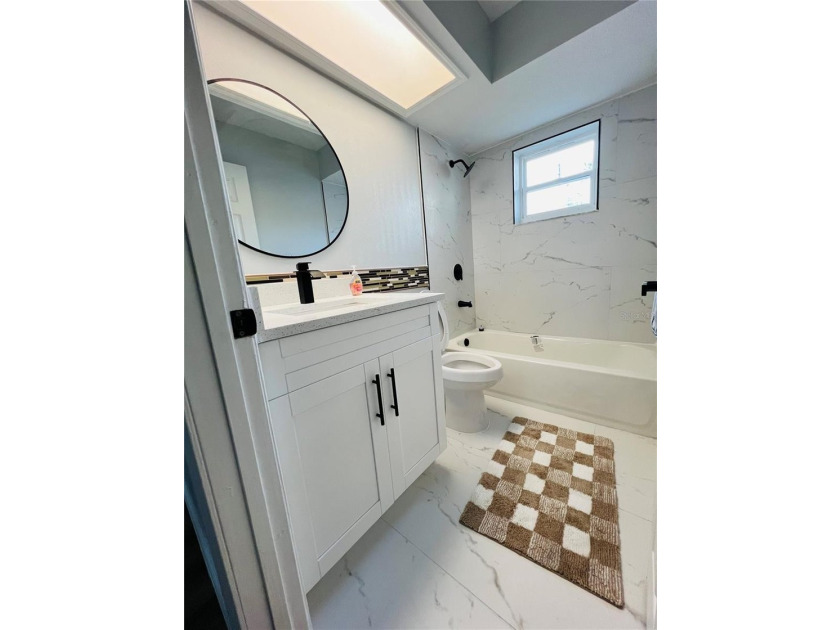 Fully remodeled, this stunning 3-bedroom, 2-bath single-family - photo 13
