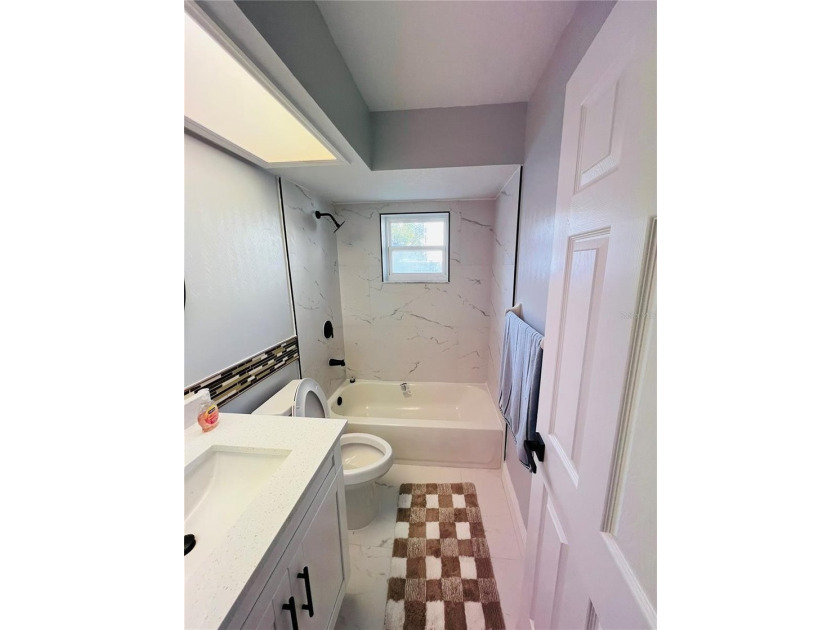 Fully remodeled, this stunning 3-bedroom, 2-bath single-family - photo 15