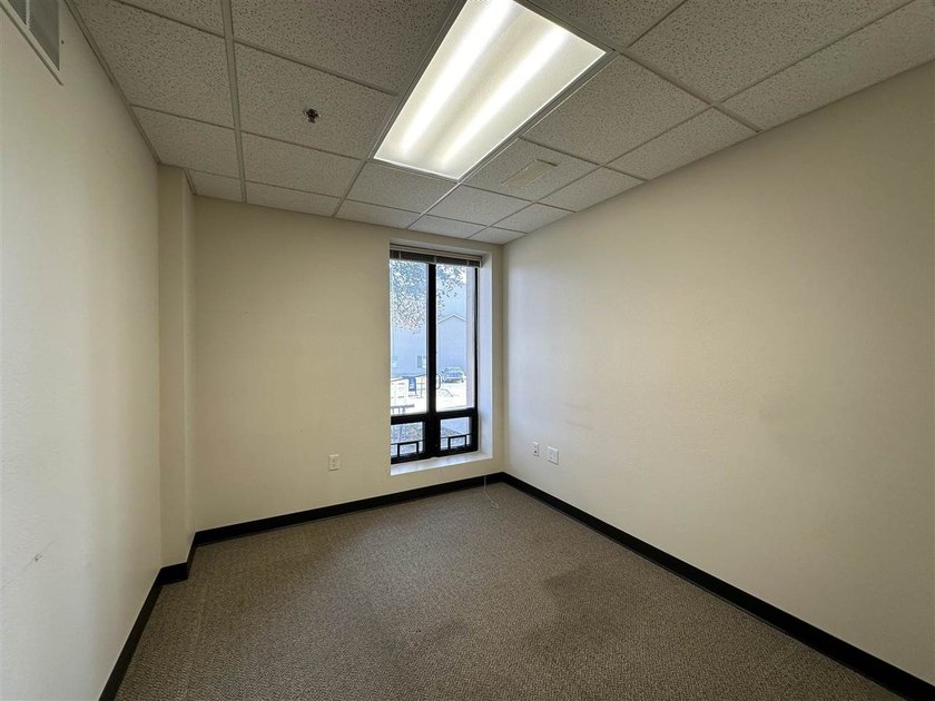 This large office offers 14 private offices, enclosed reception - photo 22
