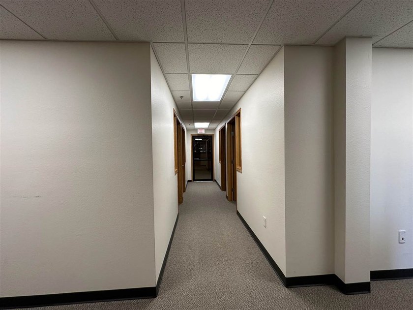 This large office offers 14 private offices, enclosed reception - photo 28