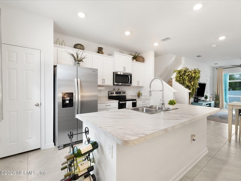 Nearly New Townhome with Backyard Oasis + Assumable 5.25% Loan! - photo 10
