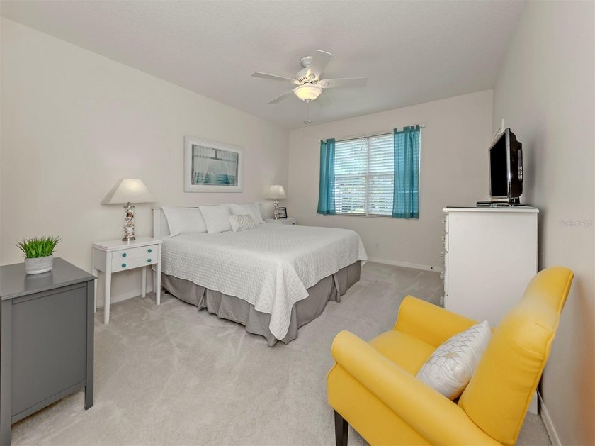 Beautifully maintained and offered furnished, this three-bedroom - photo 17