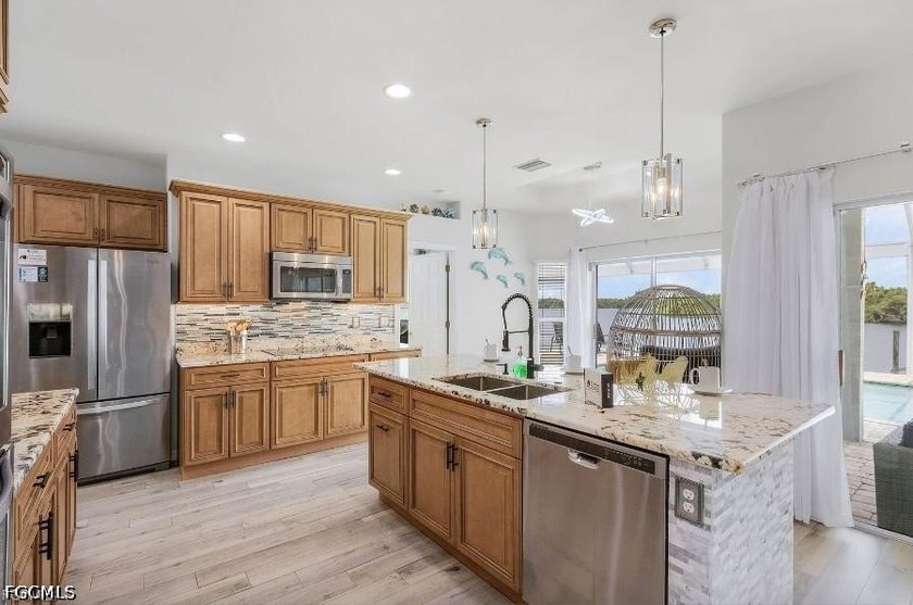 This beautiful 3 Bed 3 &amp; 1/2 Bath riverfront pool home is truly - photo 11